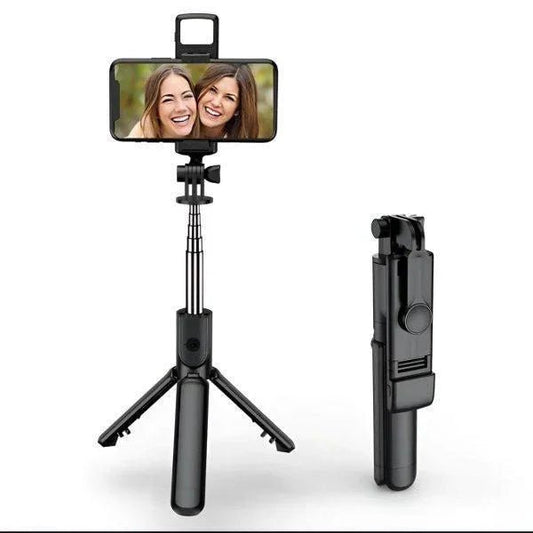A compact, black 4-in-1 selfie stick tripod with an extended phone holder and built-in LED fill light.
