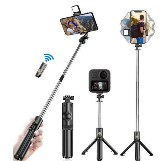 A compact, black 4-in-1 selfie stick tripod with an extended phone holder and built-in LED fill light.